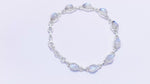 Load and play video in Gallery viewer, Natural Rainbow Moonstone Cabochon Bracelet