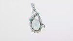 Load and play video in Gallery viewer, Natural Rainbow Moonstone Rainbow Cab & Emerald Cut Pendant